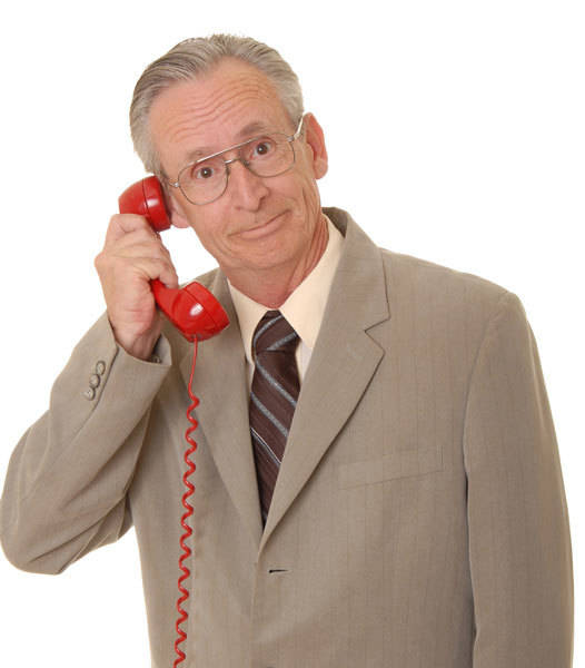 The man on the phone is calling for a free consultation from INM regarding a social media marketing package